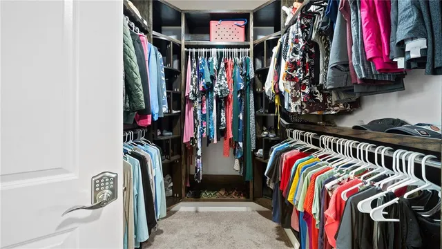 a room with a bed and a chandelier