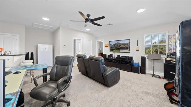 a bathroom with a granite countertop sink and a mirror with toilet
