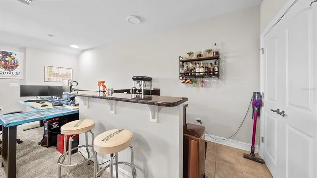 a kitchen with stainless steel appliances a sink counter top space and a large window