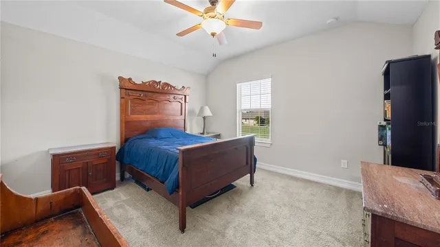 a view of backyard with roof deck and furniture