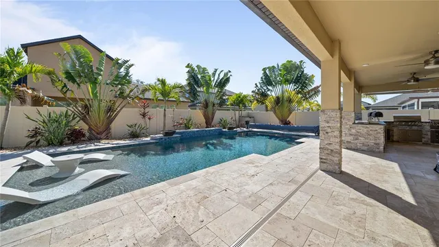 a view of a swimming pool with a patio