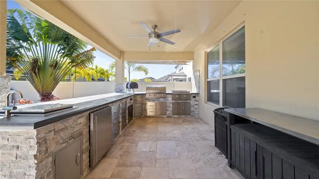 a view of a big house with a big yard and potted plants