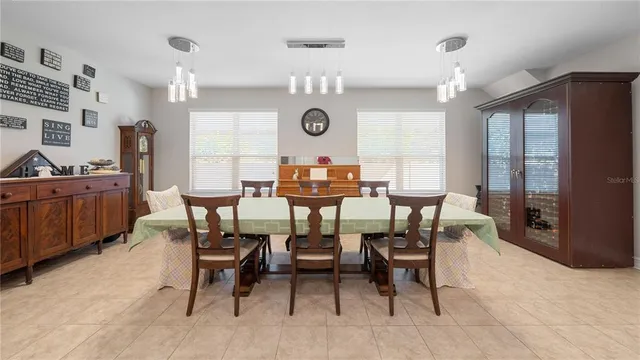 a bedroom with furniture a baby crib and a window