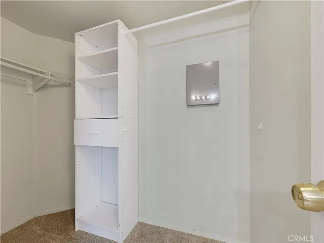 a bathroom with a toilet a sink a mirror a bathtub and vanity