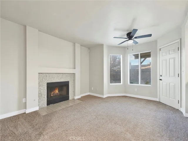 a view of livingroom with an empty room and window