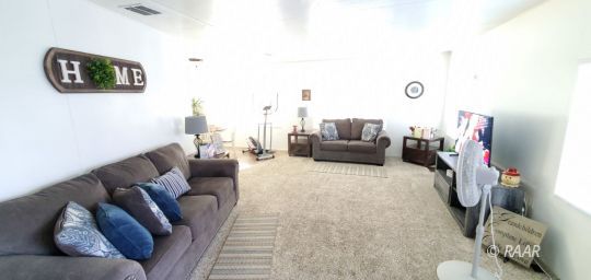 812 West Reeves Avenue Ridgecrest, CA 93555 - Photo 4 of 22 a living room with furniture and a flat screen tv