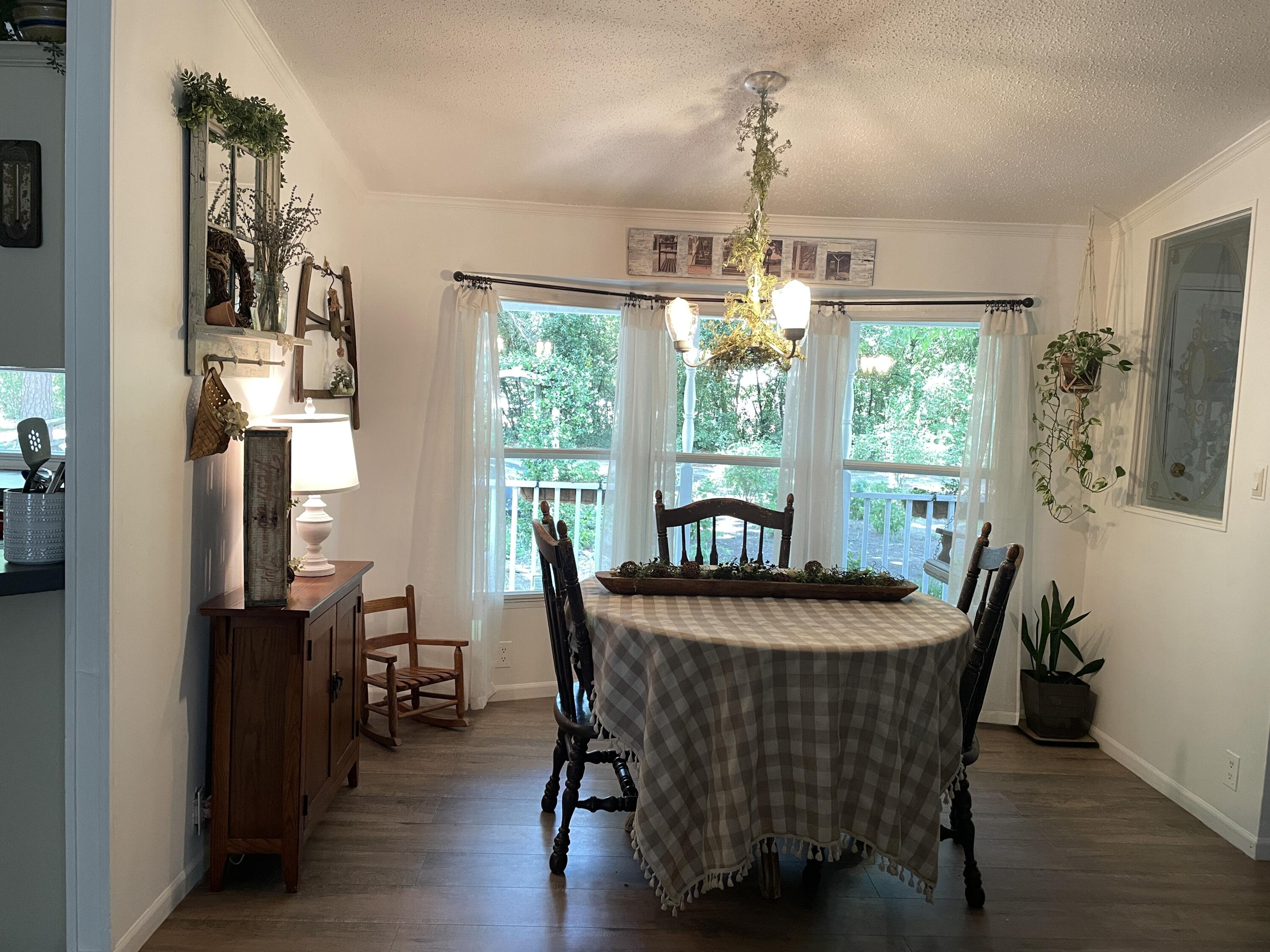 2166 Healing Springs Road Blackville, SC 29817 - Photo 3 of 43 a dining room with furniture window wooden floor