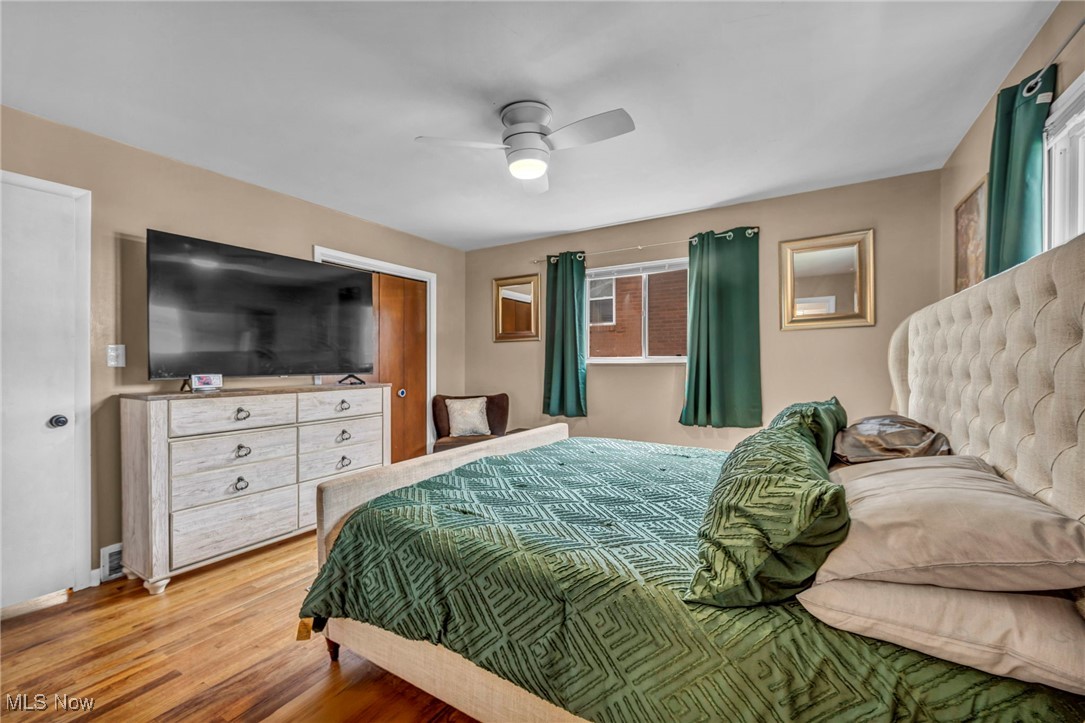 679 Garnette Road Akron, OH 44313 - Photo 15 of 47 Bedroom with baseboards, a ceiling fan, and wood finished floors