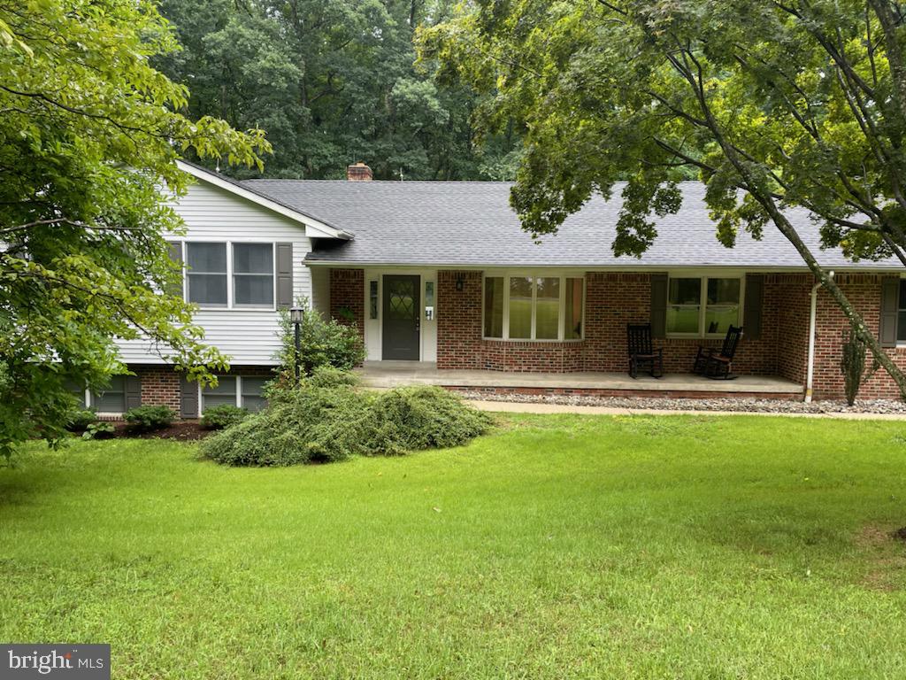 6520 Wilson Road Friendship, MD 20758 - Photo 3 of 3 a front view of house with yard and green space