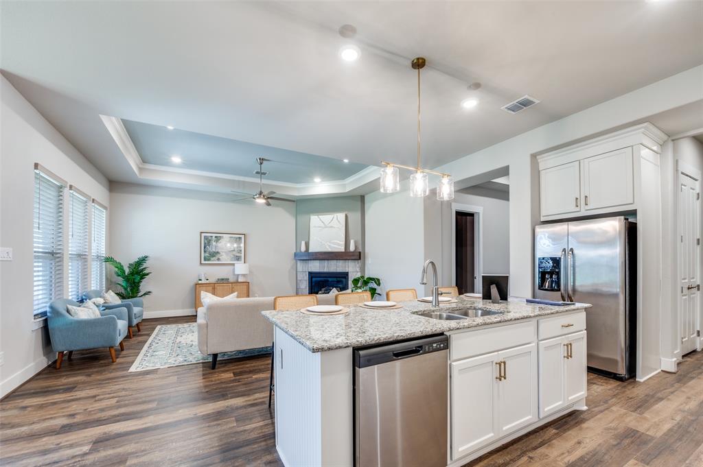 a bathroom with a sink double vanity granite and a shower