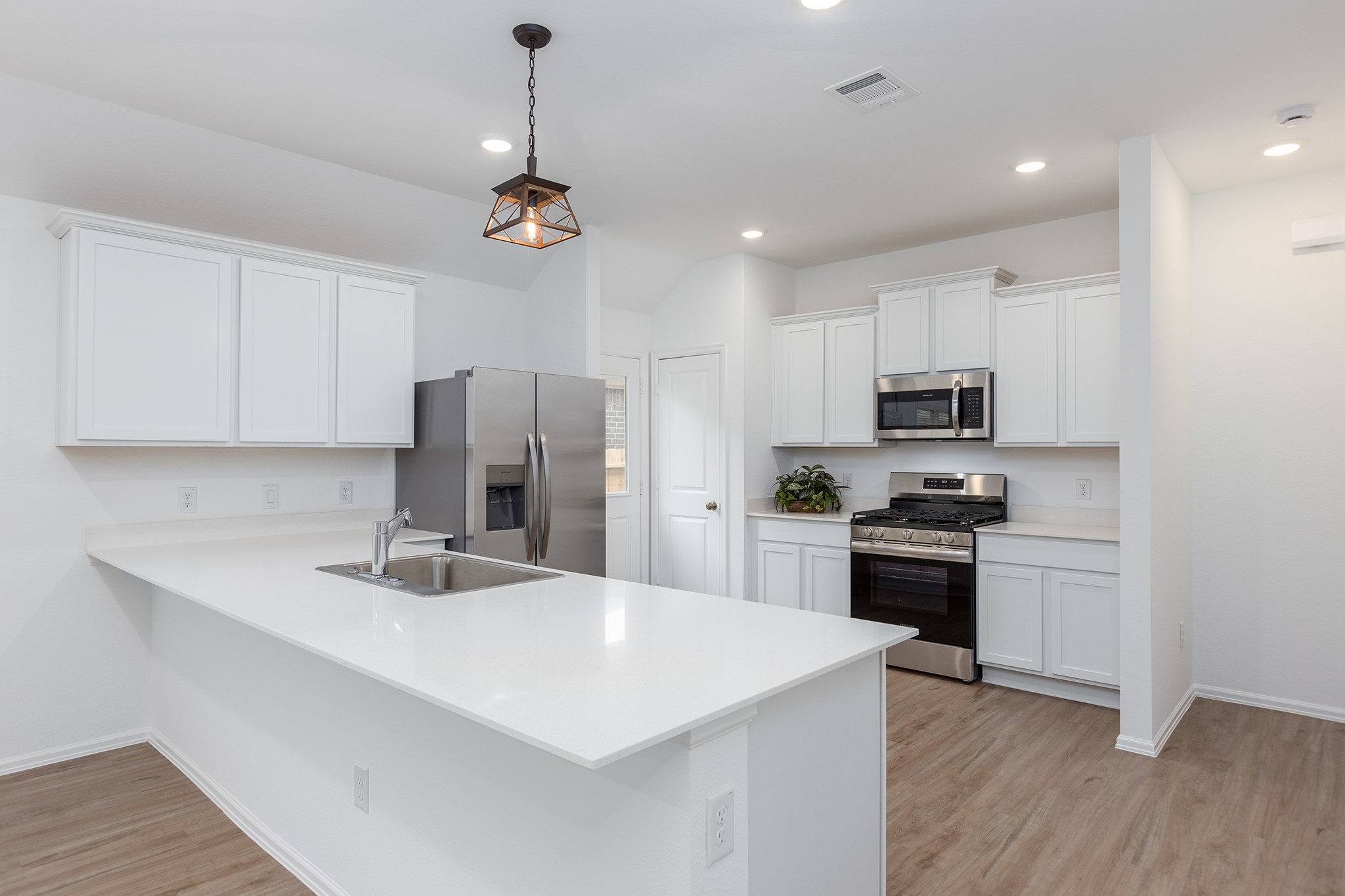 3025 Marble Rise Trail Porter, TX 77365 - Photo 6 of 33 Large modern kitchen with Quartz countertops, plenty of cabinets, and stainless steel appliances