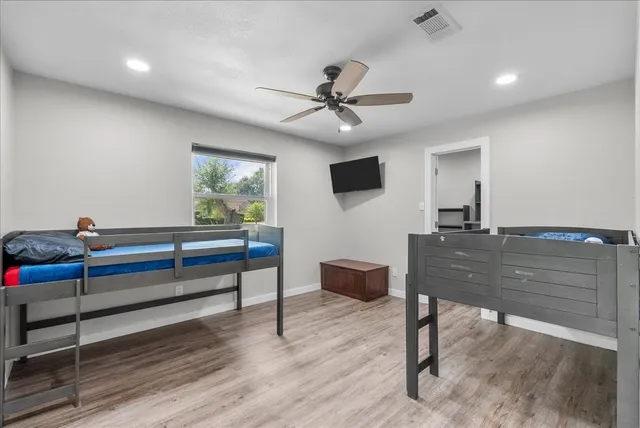 a view of a house with a patio and a yard