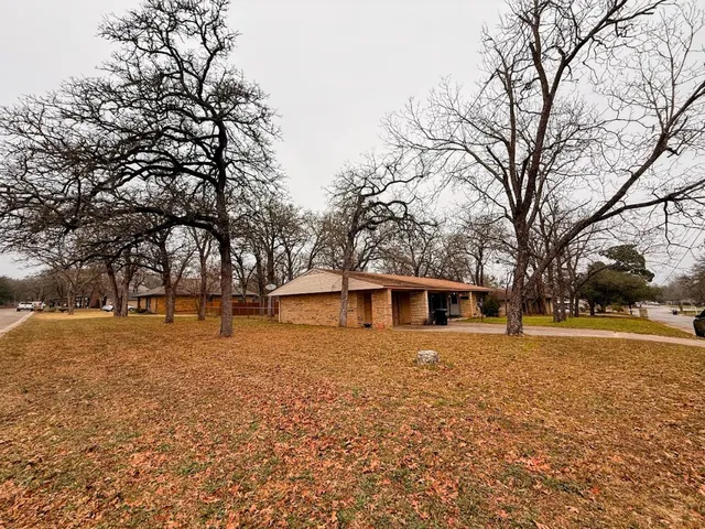 a house with trees in front of it
