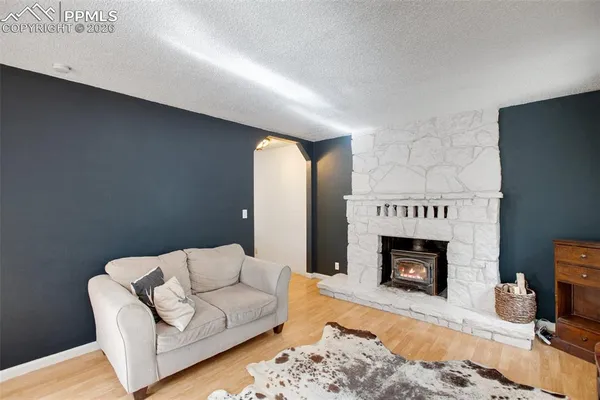 a living room with furniture a fireplace
