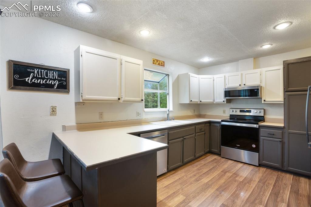 377 Ridge Road Divide, CO 80814 - Photo 23 of 50 a kitchen with cabinets a sink and appliances