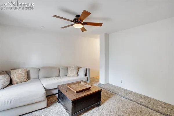 a living room with furniture and a rug