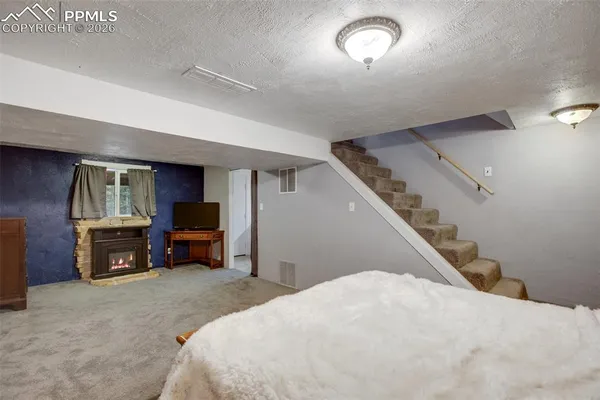 a bed room with a bed and a television