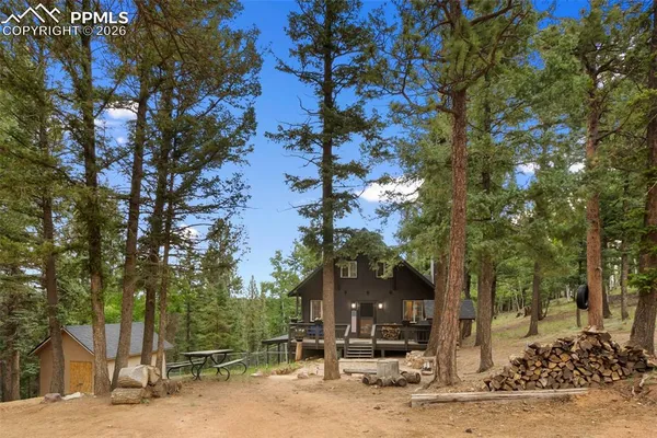 a view of a house with a tree