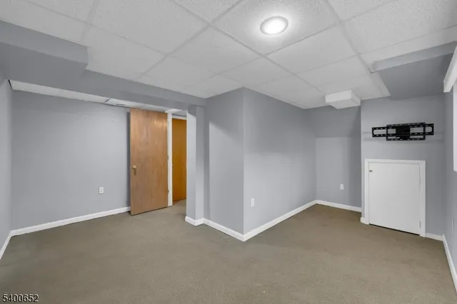 an empty room with a empty space and windows