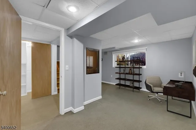 a view of a livingroom with furniture and cabinet