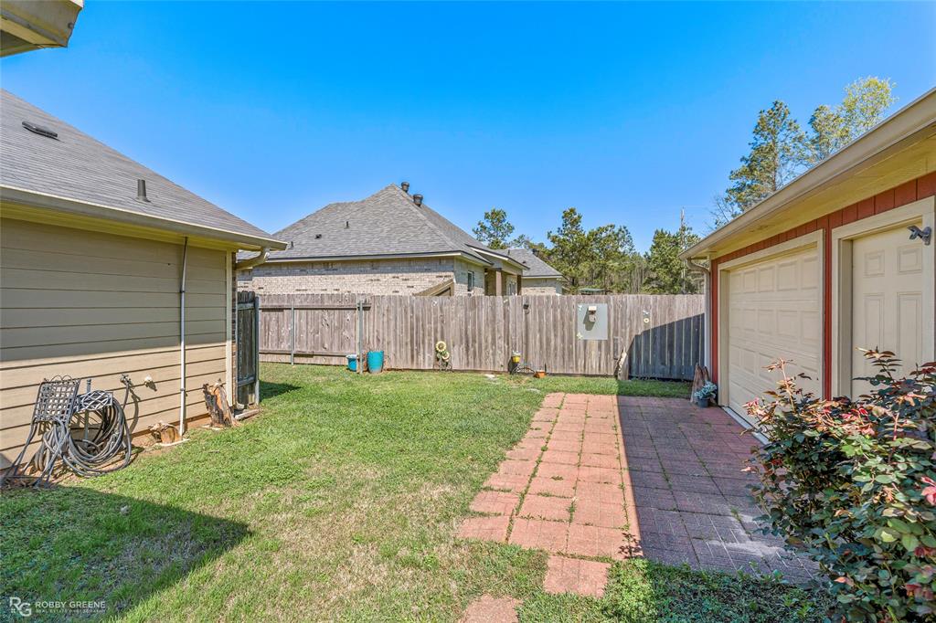 7193 Laurel Ridge Drive Greenwood, LA 71033 - Photo 12 of 40 Fenced backyard featuring a patio area
