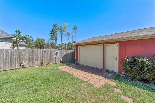 a view of a backyard with a house