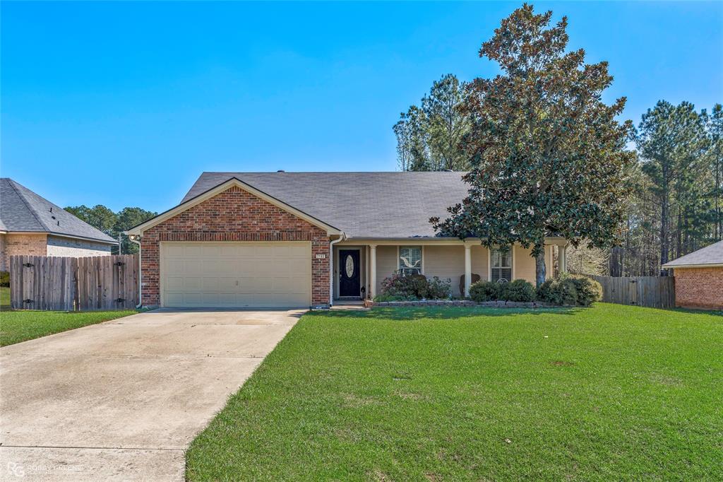 7193 Laurel Ridge Drive Greenwood, LA 71033 - Photo 2 of 40 Ranch-style home with an attached garage, concrete driveway, a shingled roof, brick siding, and a porch