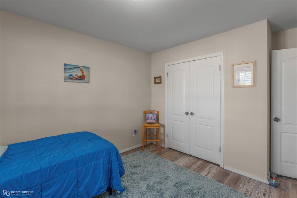 7193 Laurel Ridge Drive Greenwood, LA 71033 - Photo 32 of 40 Bedroom with light wood-style floors and a closet