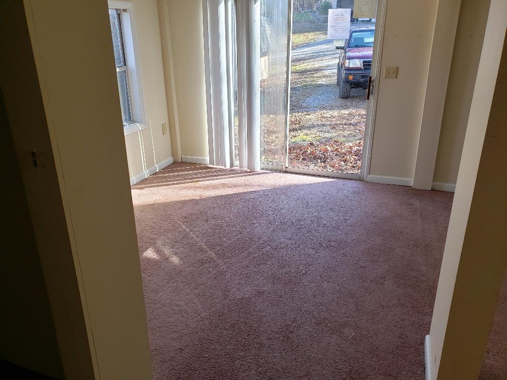 2121 Byrd Road Elliston, VA 24087 - Photo 17 of 20 a view of a room with a door and wooden floor
