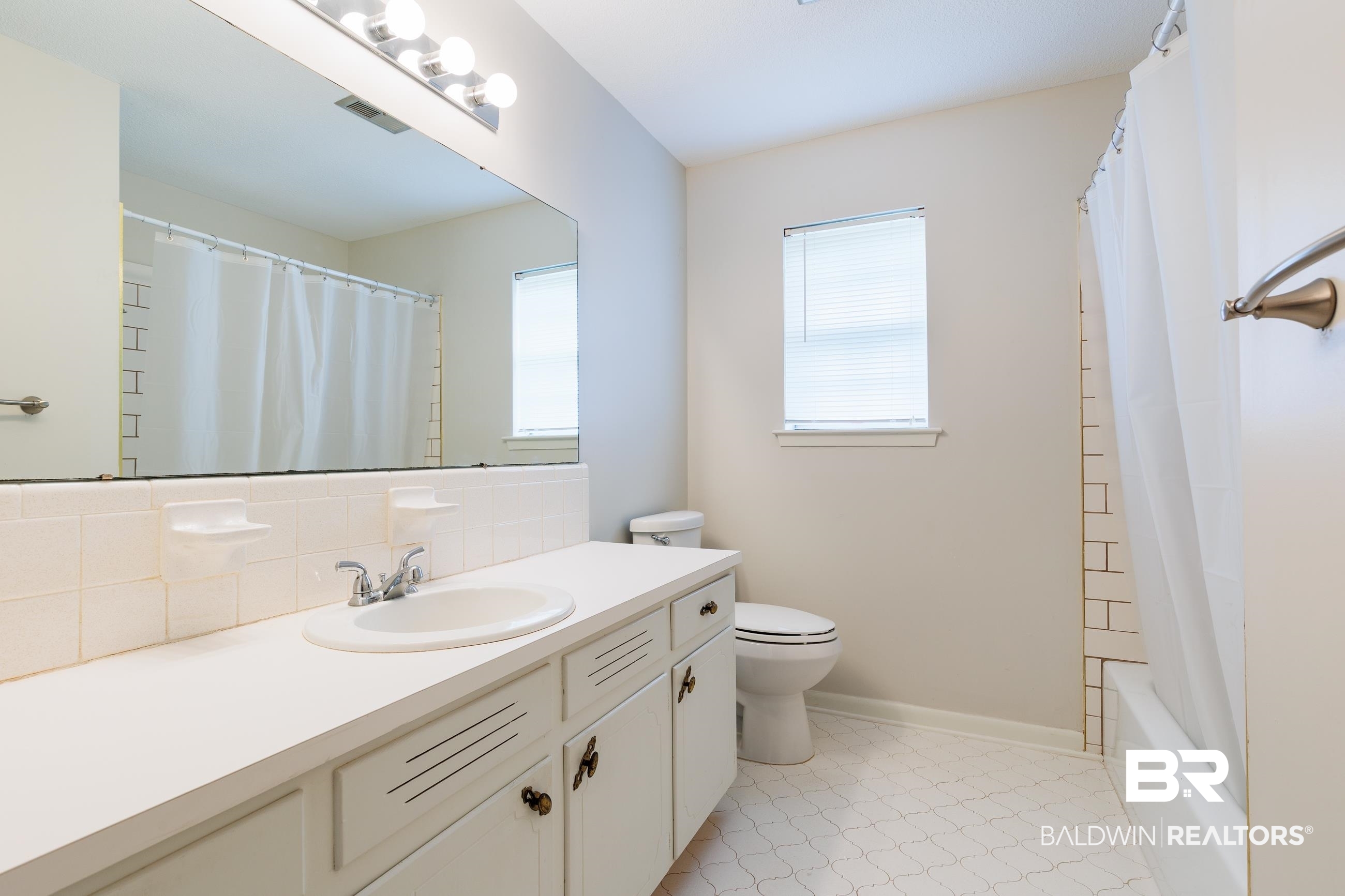 1367 Spring Valley Court Mobile, AL 36693 - Photo 11 of 29 Bathroom featuring a spacious vanity with an integrated sink, polished chrome faucet, and ample storage cabinetry