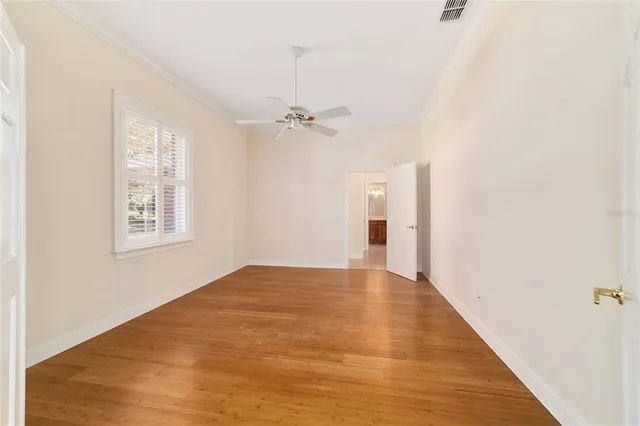 a view of an empty room with a fireplace