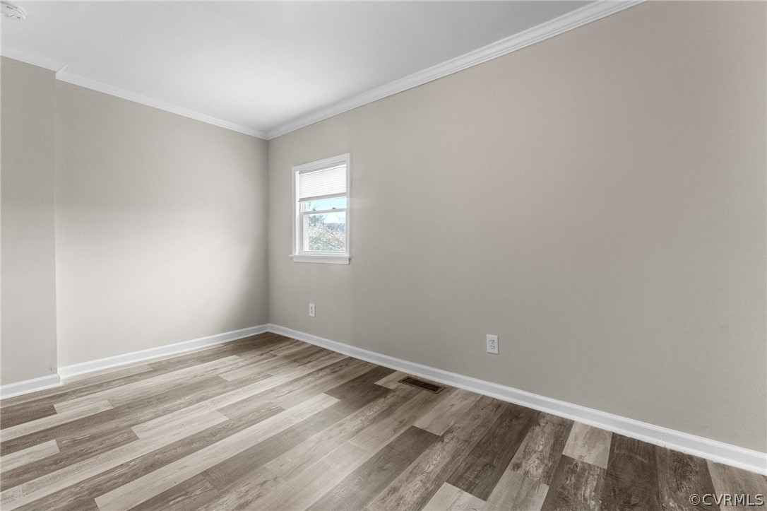 452 Harding Street Petersburg, VA 23803 - Photo 22 of 39 a view of an empty room with wooden floor and a window