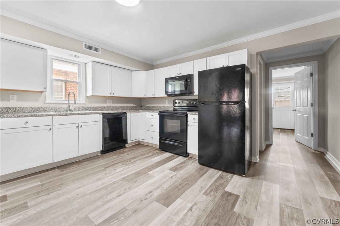 452 Harding Street Petersburg, VA 23803 - Photo 26 of 39 a kitchen with a refrigerator a sink and dishwasher