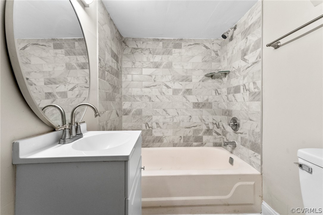 452 Harding Street Petersburg, VA 23803 - Photo 29 of 39 a bathroom with a sink and a mirror