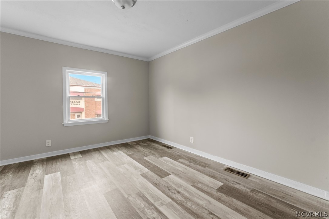 452 Harding Street Petersburg, VA 23803 - Photo 33 of 39 a view of an empty room with wooden floor and a window