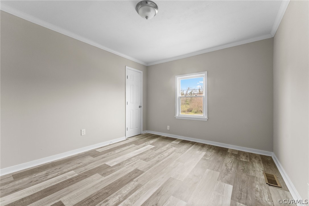 452 Harding Street Petersburg, VA 23803 - Photo 34 of 39 a view of an empty room with wooden floor and a window