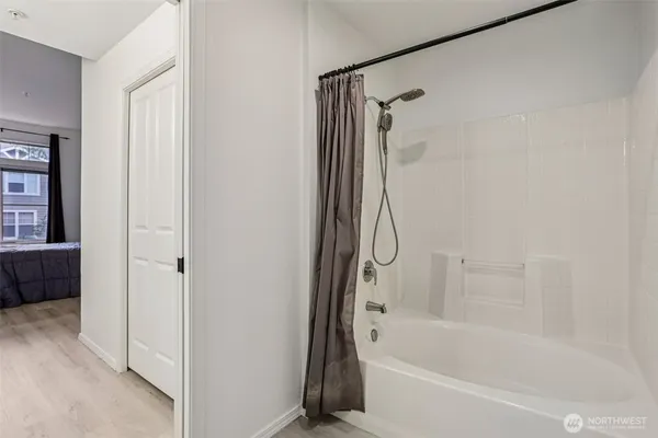 a bathroom with a bath tub and a shower