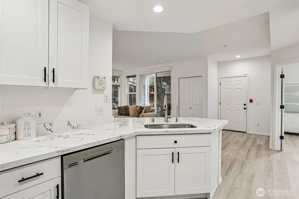 a bathroom with a sink double vanity granite and a mirror