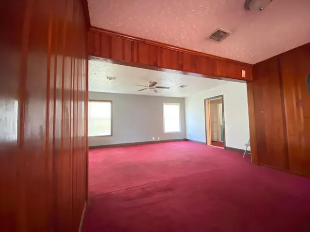 a view of empty room with windows