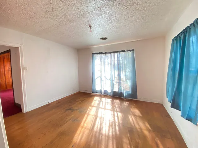 a view of an empty room and window