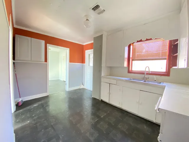 a view of a kitchen cabinets and a window