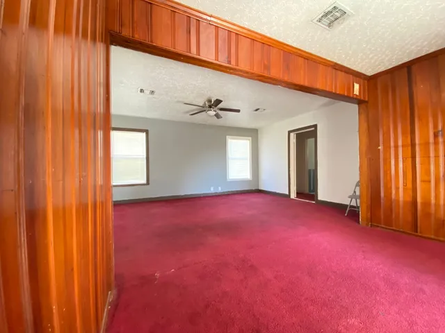a view of empty room with windows