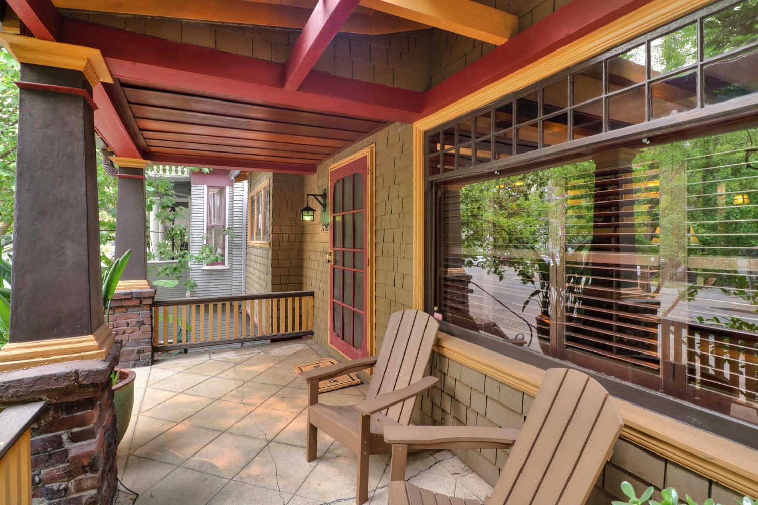 a front view of a house with outdoor seating