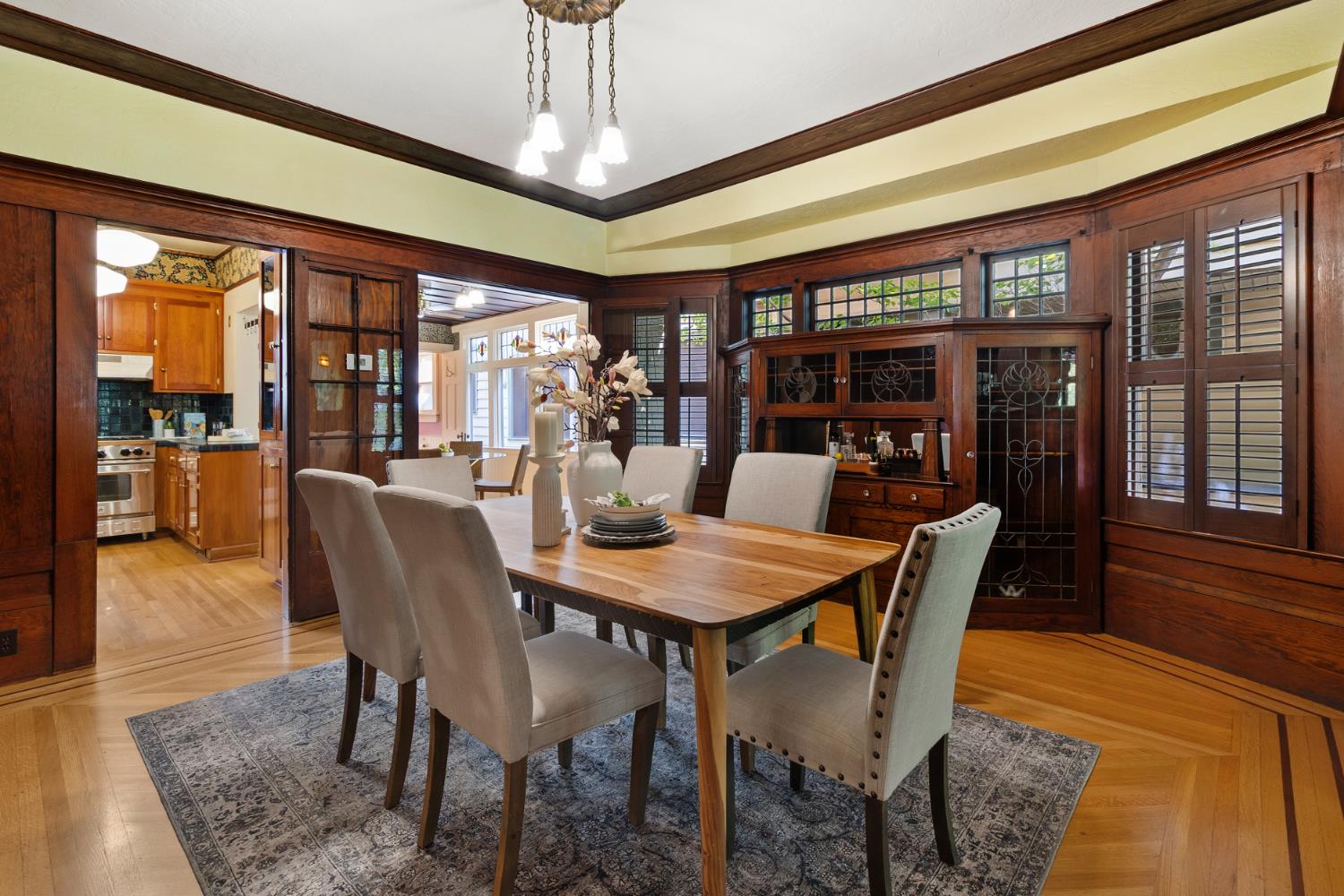 1705 H Street Sacramento, CA 95811 - Photo 11 of 50 a view of a dining room with furniture wooden floor and chandelier