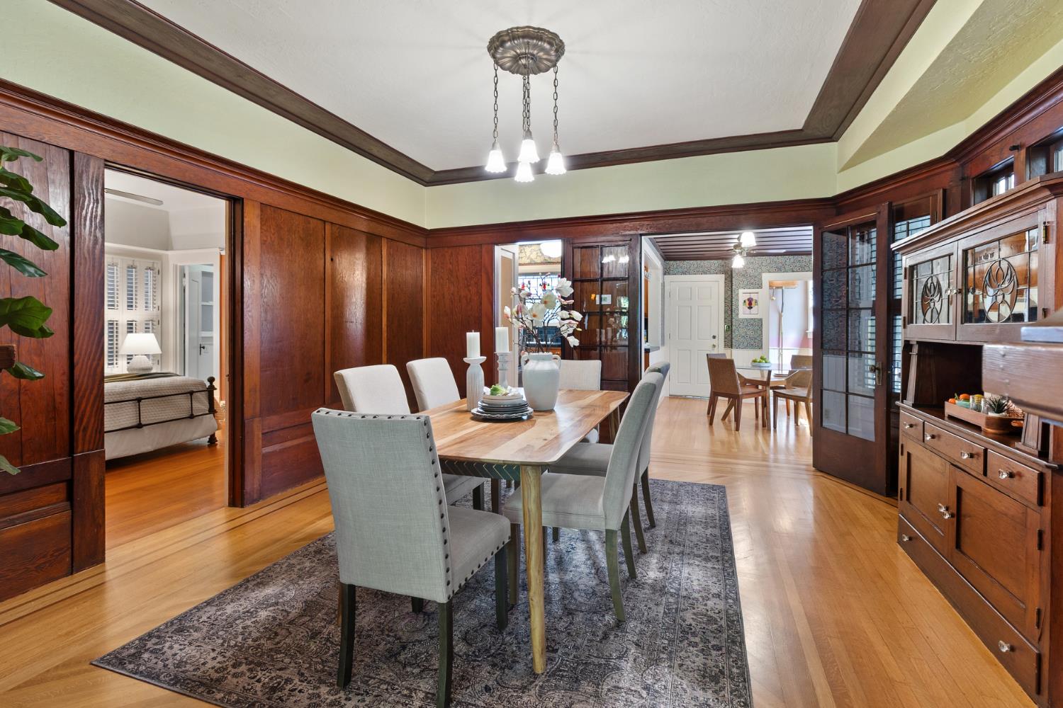 1705 H Street Sacramento, CA 95811 - Photo 13 of 50 a view of a dining room with furniture wooden floor and chandelier
