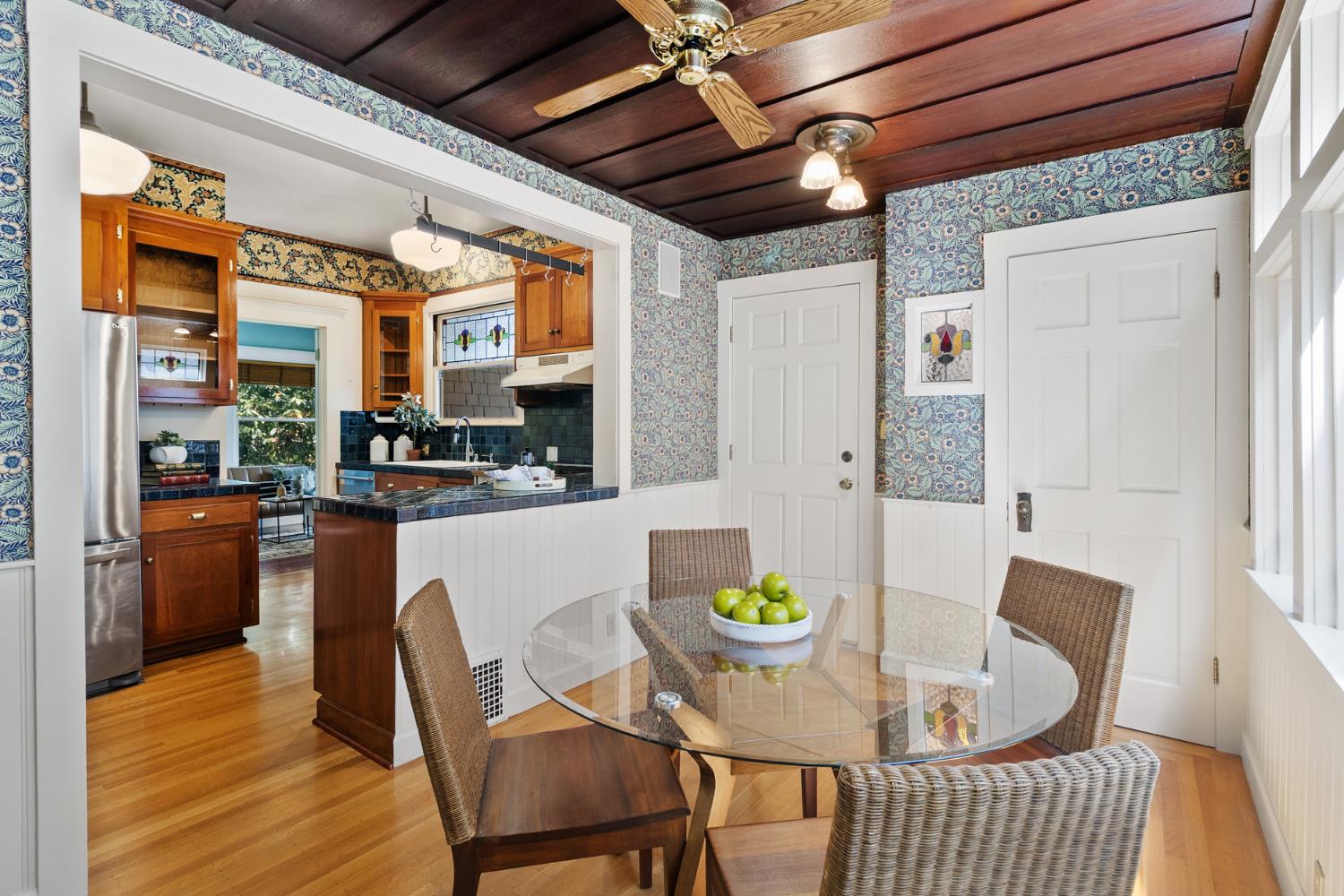 1705 H Street Sacramento, CA 95811 - Photo 16 of 50 a dining room with furniture and a kitchen view