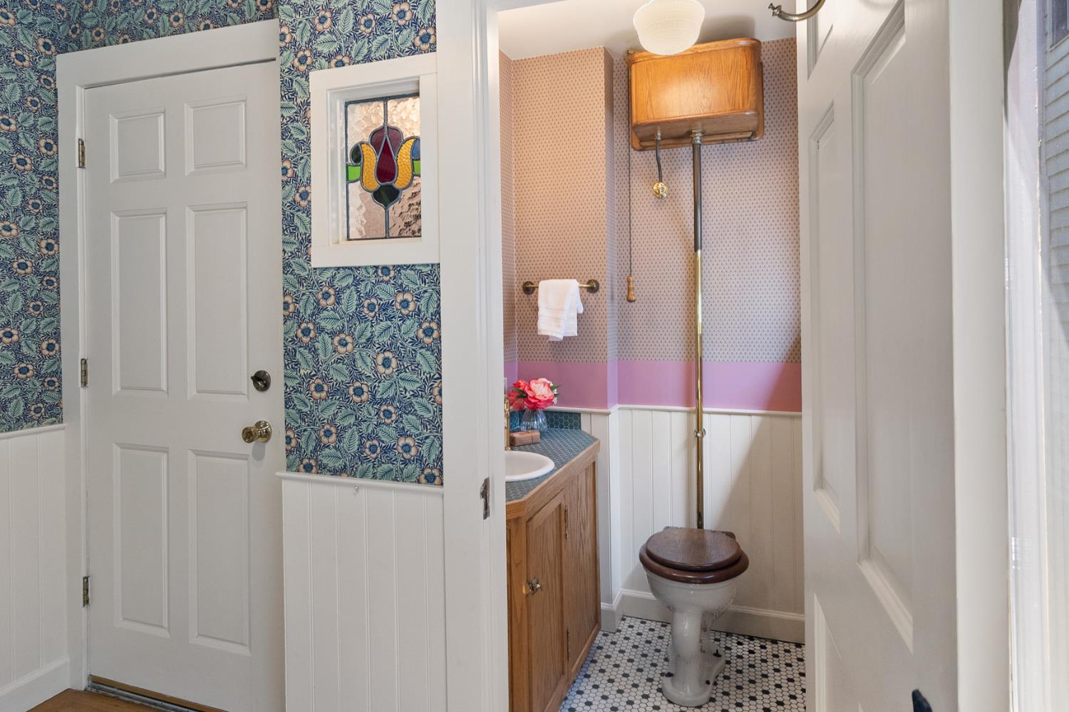 1705 H Street Sacramento, CA 95811 - Photo 17 of 50 a bathroom with a toilet and a shower curtain