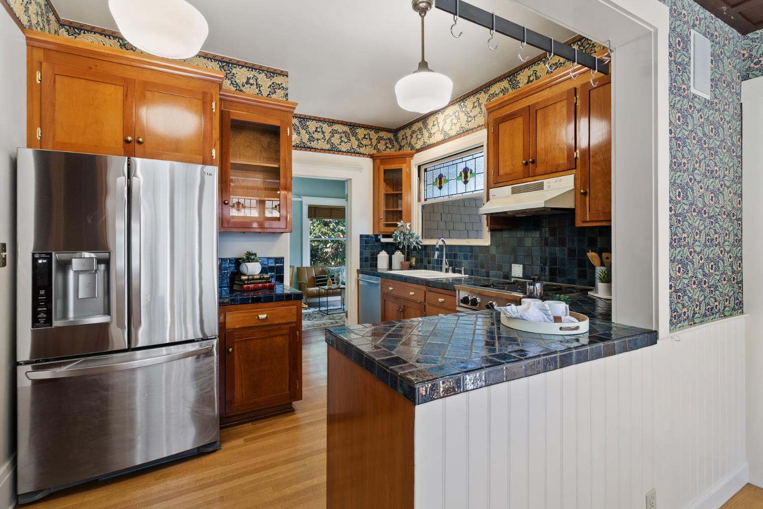 1705 H Street Sacramento, CA 95811 - Photo 19 of 50 a kitchen with stainless steel appliances granite countertop a refrigerator a stove and a sink