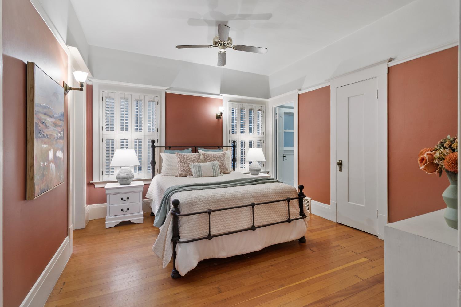 1705 H Street Sacramento, CA 95811 - Photo 25 of 50 a bedroom with a bed and a chandelier