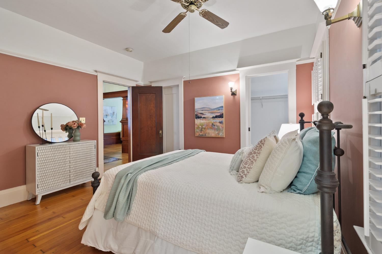 1705 H Street Sacramento, CA 95811 - Photo 26 of 50 a bedroom with a bed and a chandelier